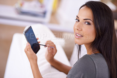 Buy stock photo Woman, home and sofa on smartphone with stylus for online research, information or social media networking. Portrait, female person and living room with touchscreen for internet and entertainment