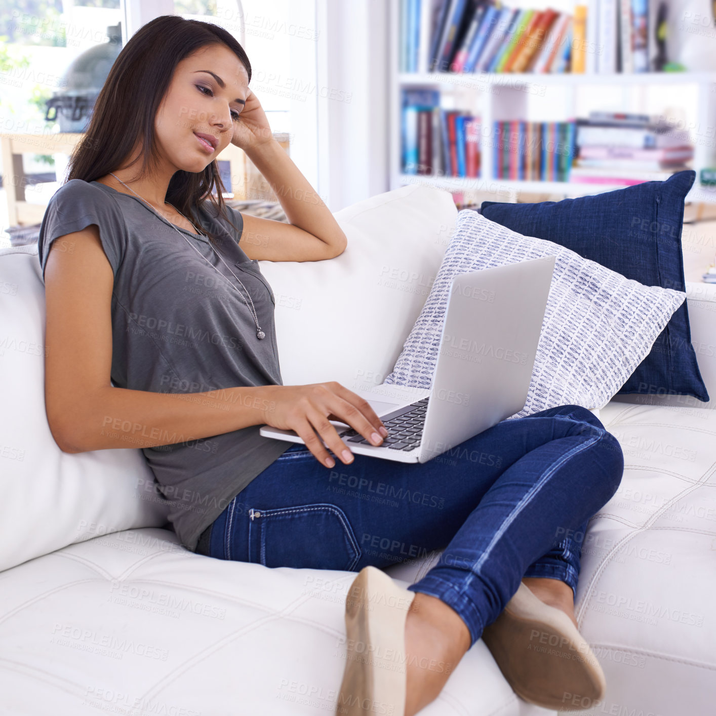 Buy stock photo Woman, laptop and online in home for relax with typing email, communication and internet research in living room. Person, technology and social media search, web subscription or writing blog on couch