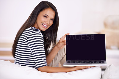 Buy stock photo Portrait of an attractive young woman holding open her laptop