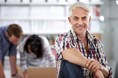 Buy stock photo Portrait of a confident mature businessman in a laid-back office environment