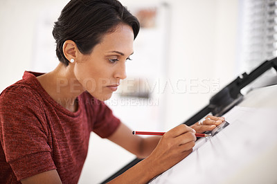 Buy stock photo Shot of an attractive young architect working in her office
