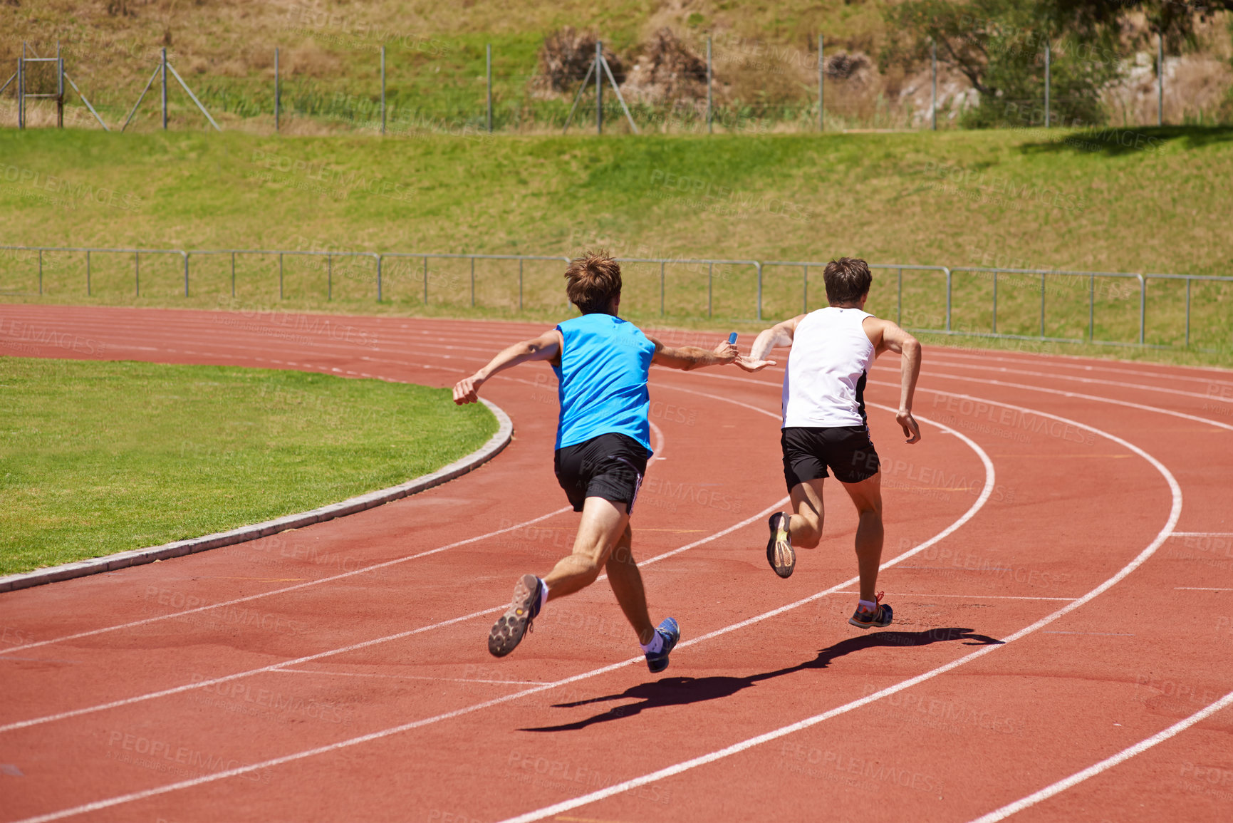 Buy stock photo Athlete, running and race track with relay and team at stadium, fitness and workout outdoor. People in arena, runner and exercise with sports, trust and support for challenge, speed and action