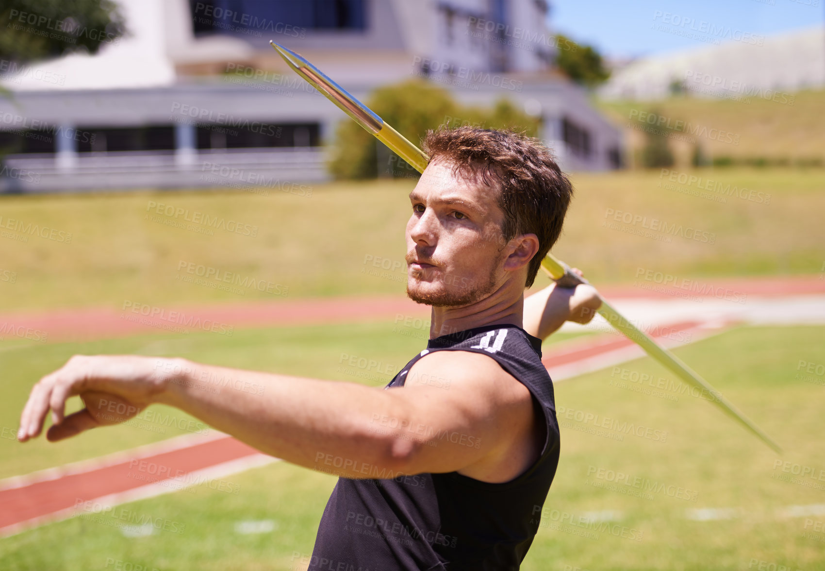 Buy stock photo Shot of a lone man throwing a javelin outside