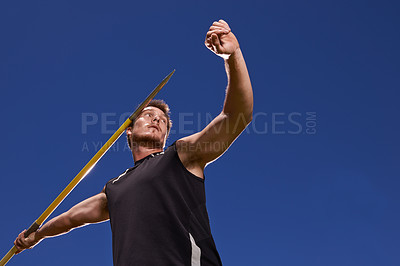 Buy stock photo Man, athlete and javelin throw for competition sport with arm strength for performance practice, challenge or blue sky. Male person, stick and target aim or outdoor activity, professional or champion