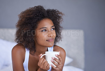 Buy stock photo Black woman, face and thinking with coffee in bed for morning, vision or memory in comfort at home. Young African female person with afro in wonder or thought with beverage or drink in the bedroom