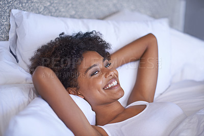 Buy stock photo Cropped shot of a young woman lying on her back