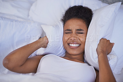 Buy stock photo Cropped shot of a restless young woman lying in bed