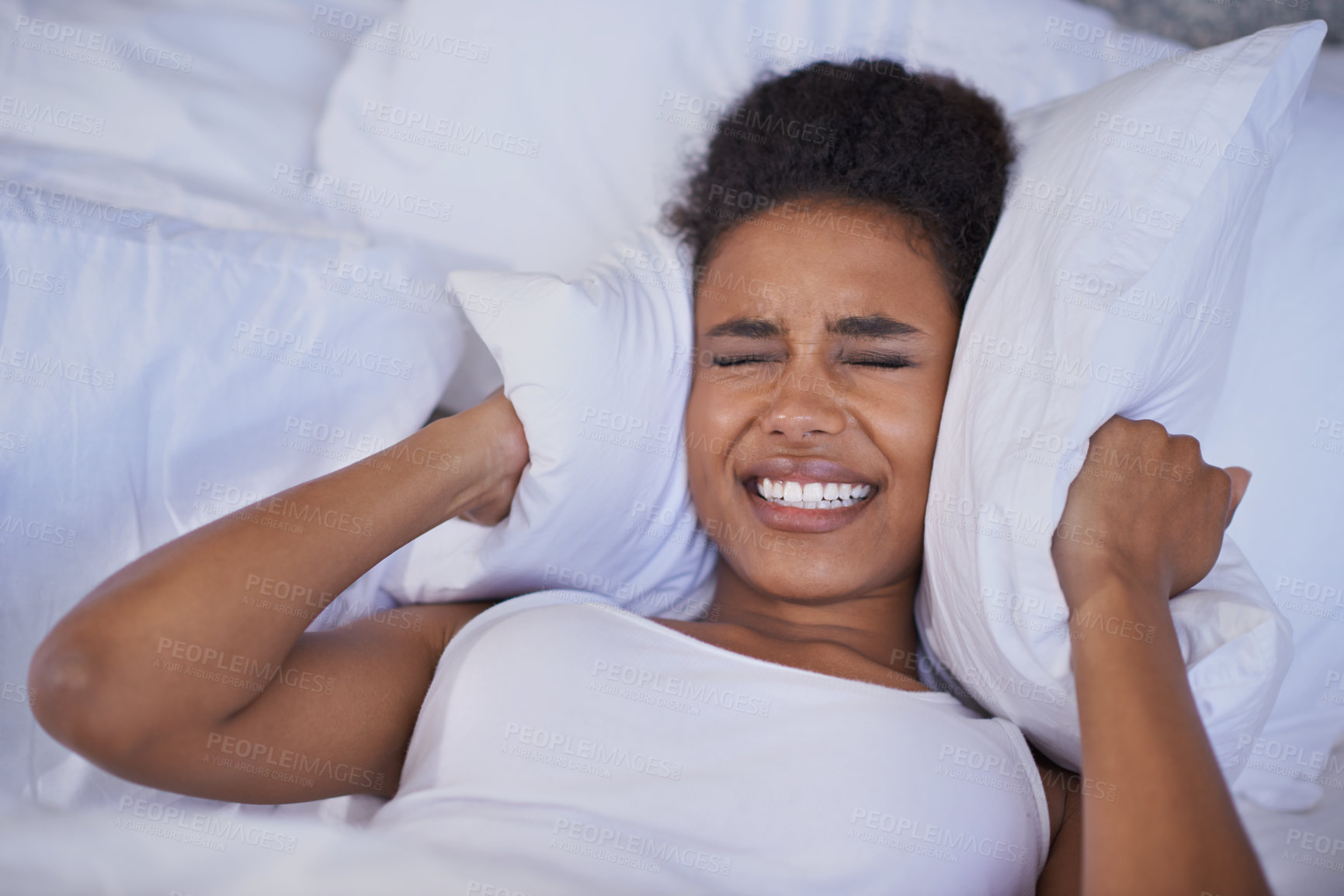 Buy stock photo Cropped shot of a restless young woman lying in bed