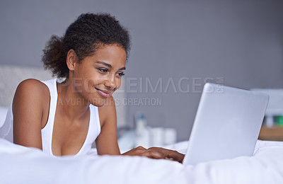 Buy stock photo Black woman, laptop and bed to relax on social media, internet or email as digital communication. Happy, female blog writer or computer as typing to browse, search or online news on web network