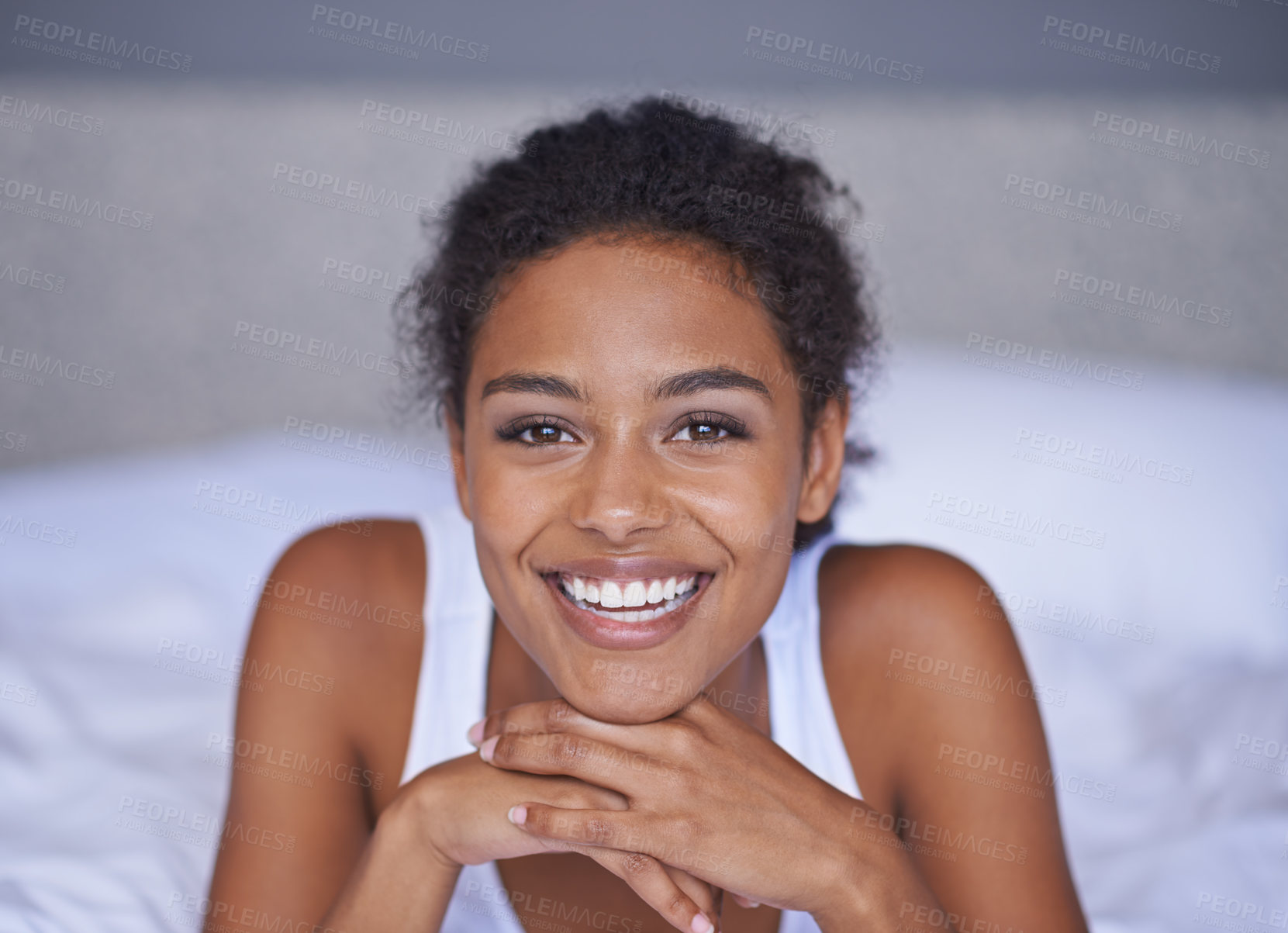 Buy stock photo Woman, happy and relax in bedroom in portrait, wellness and confident on morning vacation on home. Young lady, smile face and healthy on break on lazy weekend, pyjamas and calm on bed in apartment