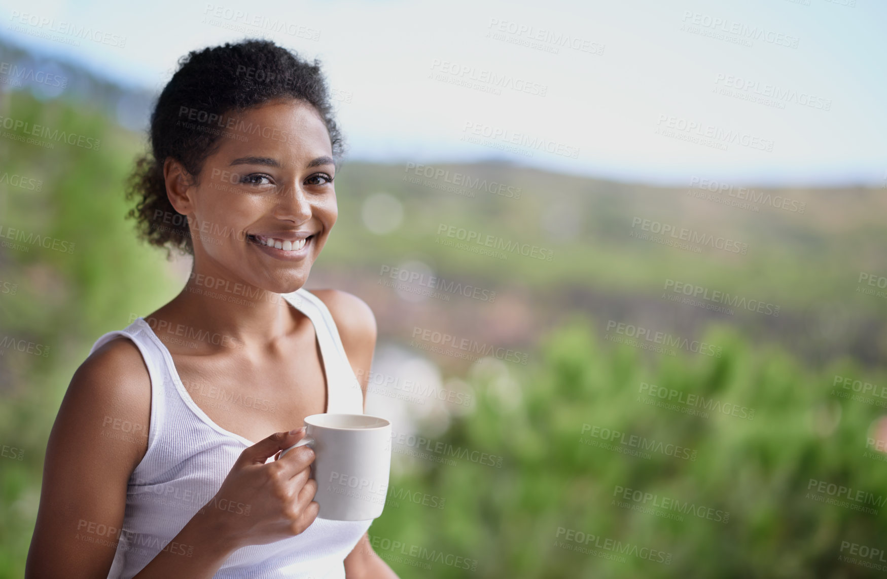 Buy stock photo Black woman, portrait and balcony with coffee in relax for morning, breakfast or natural view of the countryside. Face of calm African female person with smile, beverage or drink on terrace at home