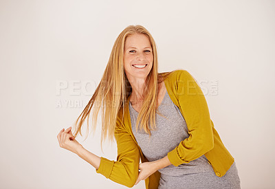 Buy stock photo Smile, fashion and portrait of woman in studio with casual, trendy and cool outfit with confidence. Happy, attractive and female person playing with hair for cardigan style by white background.