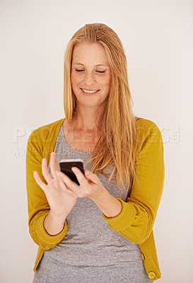 Buy stock photo Smile, woman and smartphone for contact, communication and texting with technology isolated on white background. Happy, female person and mobile phone for connectivity, internet and app in studio