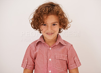 Buy stock photo Smile, fashion and boy child in studio with casual, trendy and cool shirt for outfit with curly hair. Happy, cute and portrait of adorable young kid model with style isolated by white background.