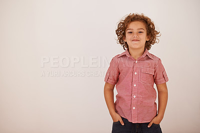 Buy stock photo Shot of a young boy standing indoors