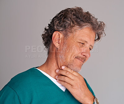 Buy stock photo Mature man, thinking and confused in studio, question and choice or decision on gray background. Male person, contemplating and planning for wellness in retirement, doubt and unsure on mockup space