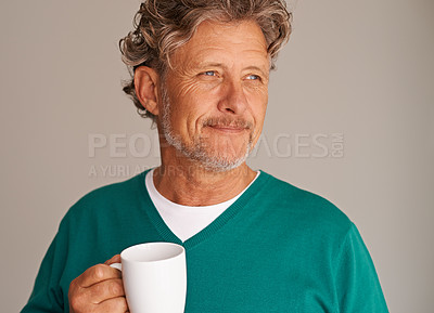 Buy stock photo Mature man, coffee and thinking in studio with smile, memory and vision with life choice by background. Person, tea cup and remember with nostalgia, decision and latte with drink, fashion and ideas