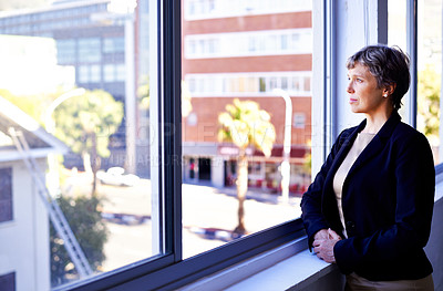 Buy stock photo Vision, thinking and mature businesswoman at window in office with idea, opportunity and professional at work. Reflection, memory and woman planning future growth, ambition and inspiration for career