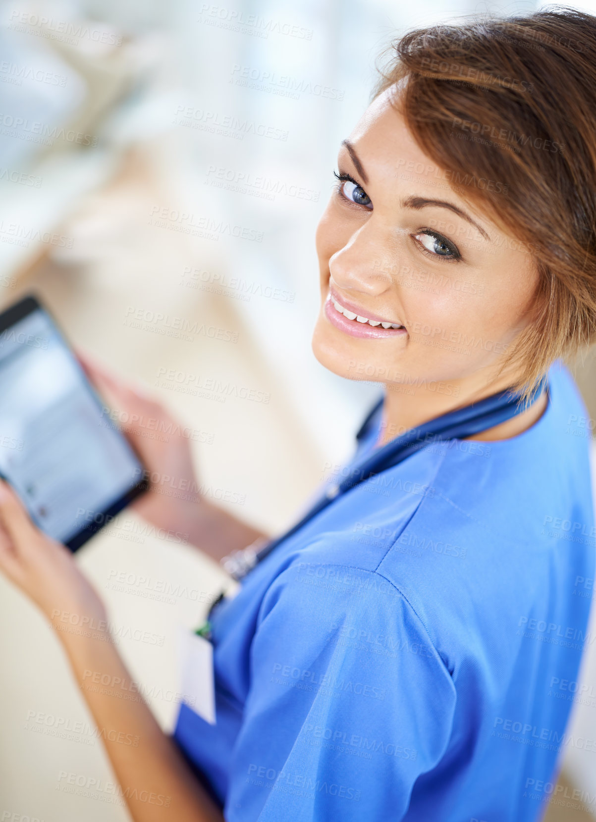 Buy stock photo Medical, tablet and portrait of nurse woman in scrubs at hospital for research or info from above. Healthcare, technology and smile on face of happy young medicine professional in clinic for results
