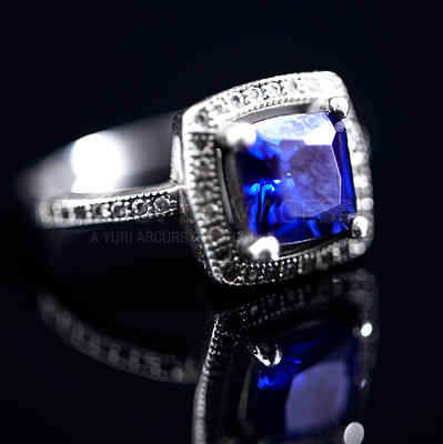 Buy stock photo Sapphire, silver ring and studio by black background for closeup, vintage product and luxury. Tanzanite, blue gemstone and white gold with precious metal for jewelry, shine and glow with reflection