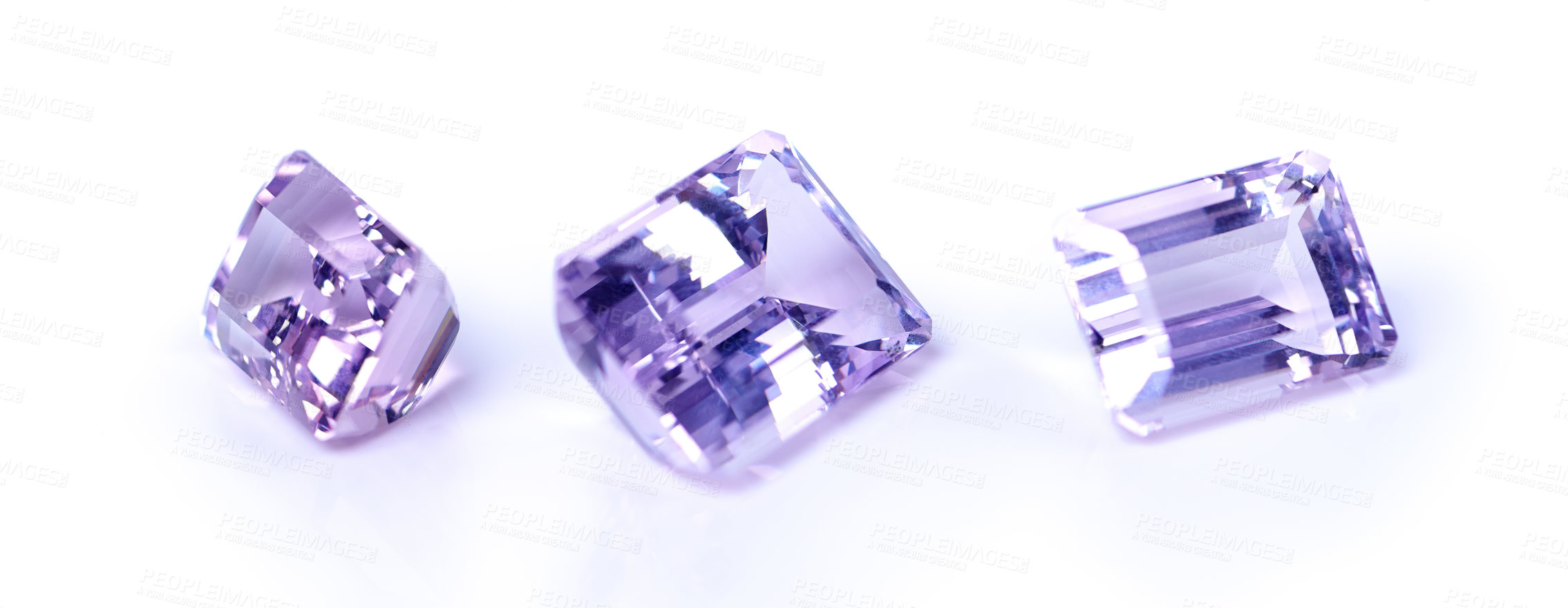 Buy stock photo Amethyst, stone or rock in studio by white background for natural resource, jewelry and baguette for luxury. Gemstone, purple crystal and closeup with shine, glow and brilliant with cut for wealth