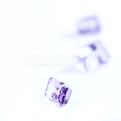 Buy stock photo Amethyst, rocks or stone in studio by white background for natural resource, jewelry and baguette for luxury. Gemstone, purple crystal and closeup with shine, glow and brilliant cut for collection