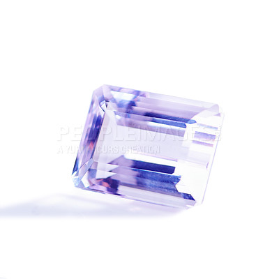 Buy stock photo Purple, gemstone or jewelry on a white background for luxury, expensive and rich design in studio. Violet, diamond or crystal rock for texture, glamor and ring with shine and reflection for gift