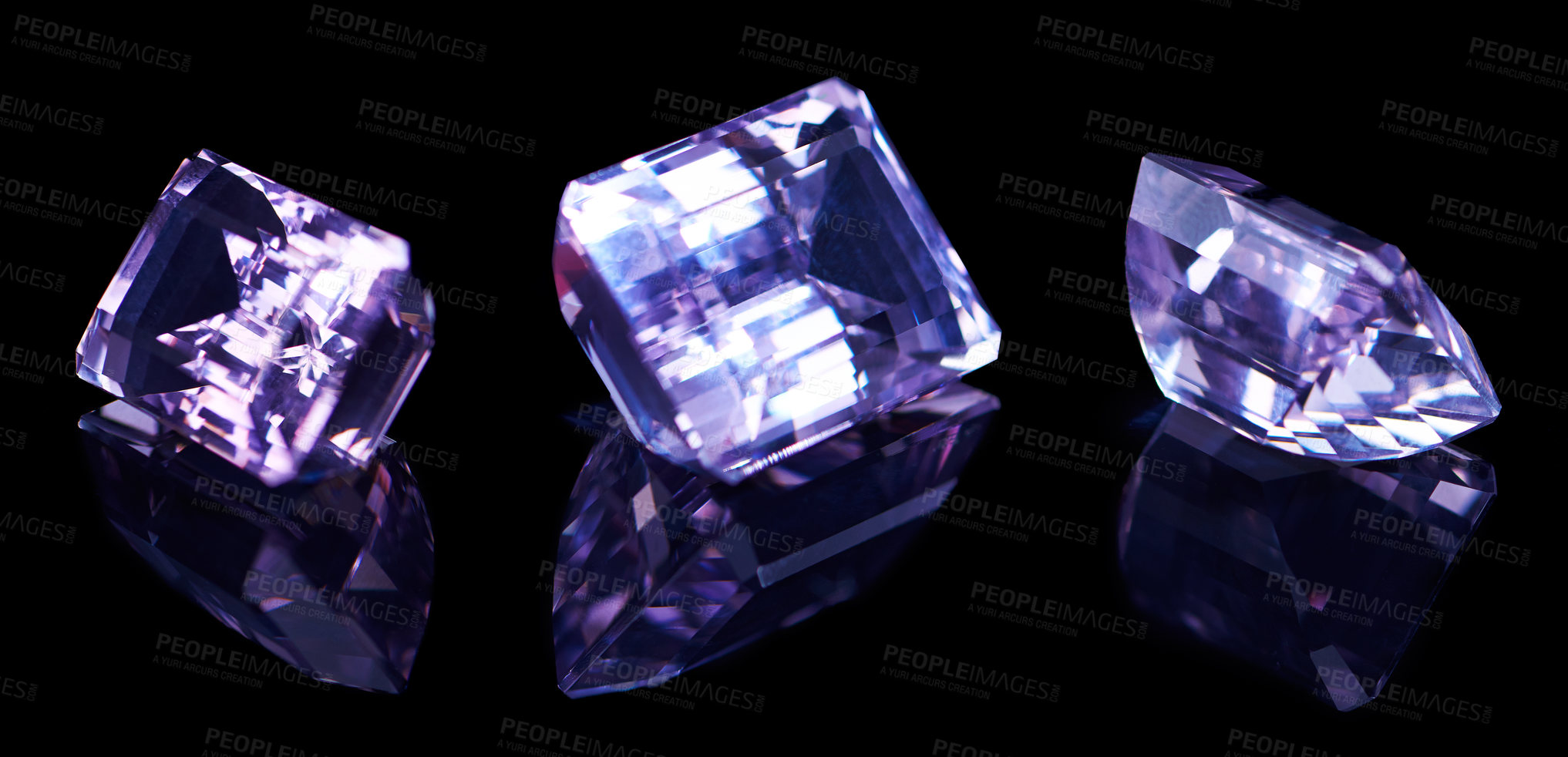 Buy stock photo Purple, gemstone and rock on black background for luxury, expensive and glass textures in studio. Violet, diamond or crystal with treasure, shine and ring production in reflection for gift or present