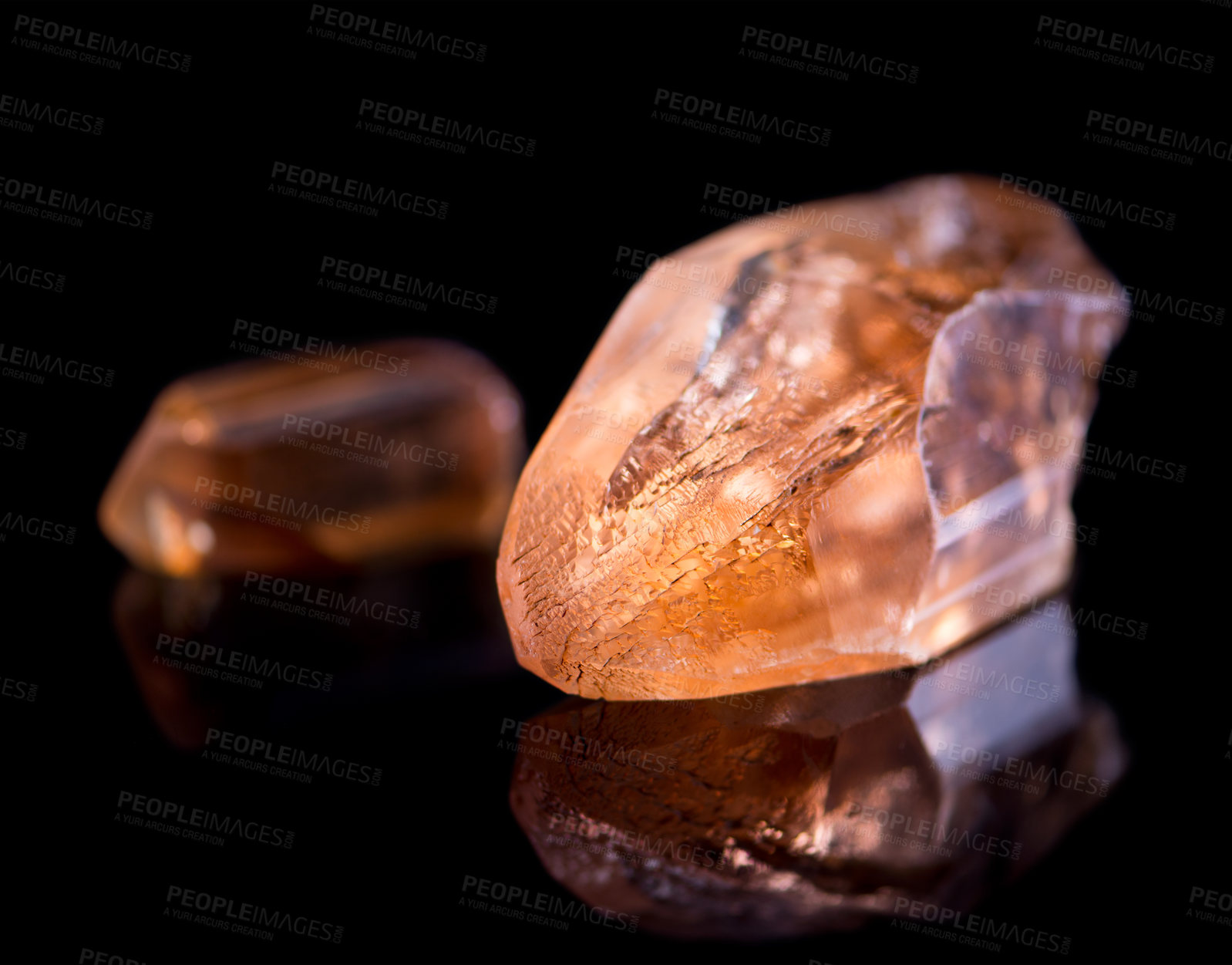 Buy stock photo Orange stone, jewel and crystal in studio with isolated black background for natural resource, shine and sparkle for luxury. gemstone, rock and reflection in closeup for citrine, glow and mineral