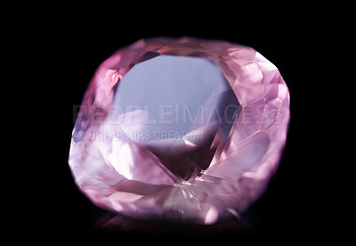 Buy stock photo Pink diamond, jewel and stone by black background for natural resource, sparkle and luxury. Rocks, mineral and crystal in closeup for gem with shine, glow and brilliant cut with reflection in studio