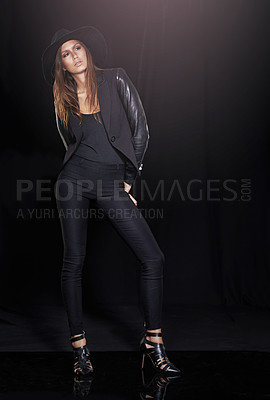 Buy stock photo Classic fashion, thinking and young woman in studio on black background with flare for classy chic. Leather, model and vision with confident person in dark or trendy clothes outfit for style