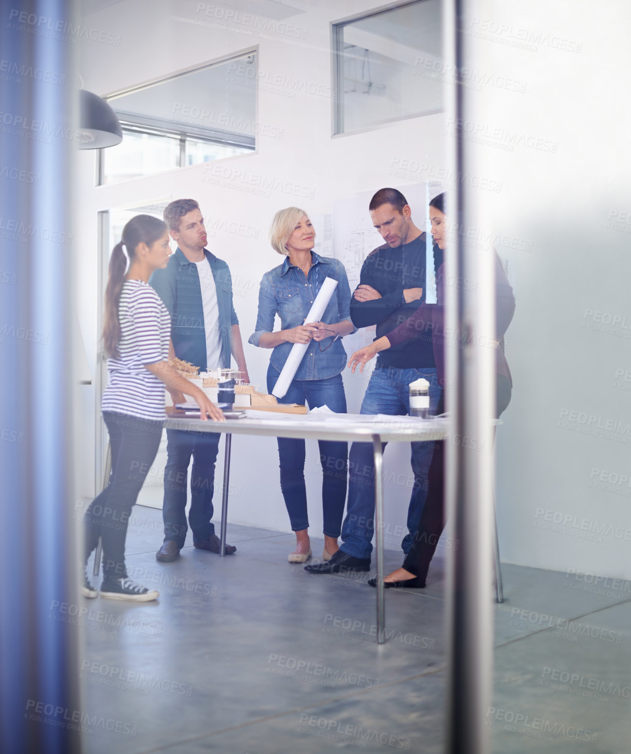 Buy stock photo Full length shot of a group of architects discussing plans