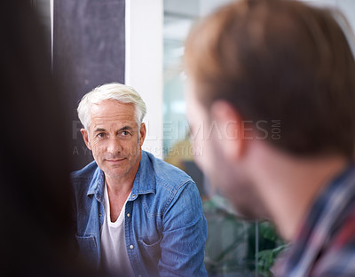 Buy stock photo Leader, ceo or male senior manager in meeting, employees and teamwork for corporate professionals. Business, collaboration and management with mature man mentor, training or talking in office