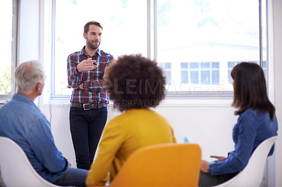 Buy stock photo Shot of a group of coworkers in a meeting
