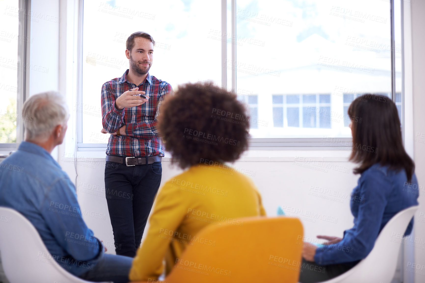 Buy stock photo Shot of a group of coworkers in a meeting