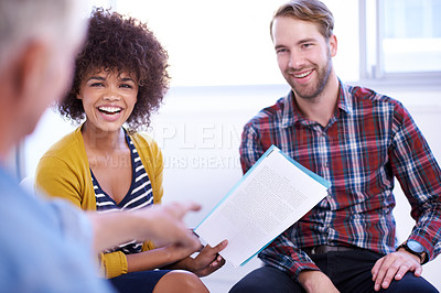 Buy stock photo Shot of an attractive young woman giving a small presentation in a meeting