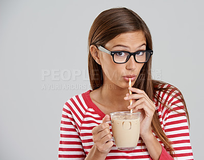 Buy stock photo Woman, portrait and iced coffee drinking in studio or sweet beverage for weekend relax, caffeine or grey background. Female person, glasses and dairy for latte smoothie, mockup space or happiness