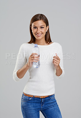 Buy stock photo Portrait, happy woman and drinking water with bottle for wellness in studio isolated on white background. Smile, model and thirsty person with liquid for hydration, nutrition or healthy diet for body