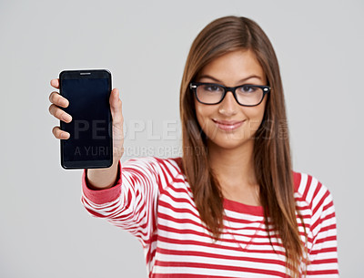 Buy stock photo Portrait, woman and showing phone screen in studio isolated on a white background. Face, smartphone and happy person with display for advertising, marketing and mockup space on app for social media