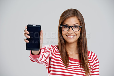 Buy stock photo Portrait, happy woman and showing phone screen in studio isolated on white background. Face, smartphone or person with display for advertising, marketing or mockup space for social media with glasses