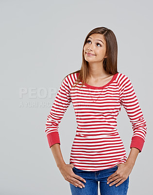 Buy stock photo Mockup, thinking and face of woman for fashion, style and trendy with cool outfit isolated on gray background. Female person, casual and lady with stripe shirt, blue jeans and smile in studio