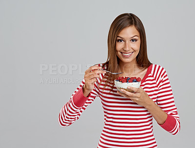 Buy stock photo Woman, bowl and smile with studio, fruit and happiness for health and wellness. Person, diet and nutrition with berries, snack and organic salad for hungry or eating isolated on white background