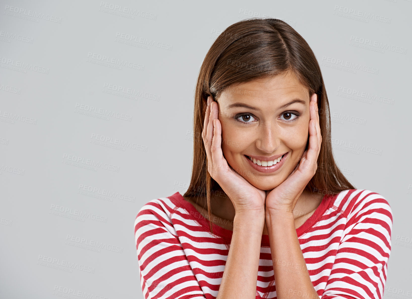 Buy stock photo Woman, portrait and smile in studio with confidence on grey background for positive mood, carefree or mockup space. Female person, face and model with happiness in Australia or hand, palm or relaxing