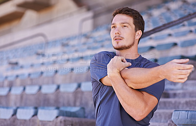 Buy stock photo Sports, arms and man stretching in stadium for race, marathon or competition training for health. Fitness, energy and male runner athlete with warm up exercise for running cardio workout on track.