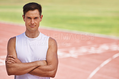 Buy stock photo Portrait of a determined looking athlete standing on the track