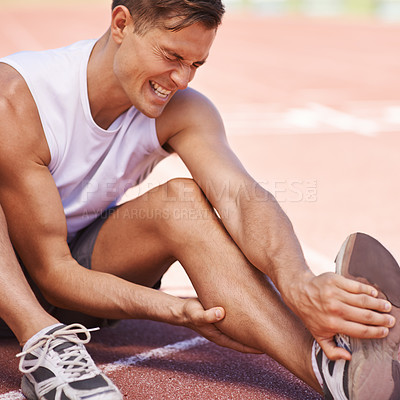 Buy stock photo Leg pain, injury and a man outdoor after exercise, running or workout at a sports stadium. Male person or runner on ground with muscle problem, accident or burnout while training for body fitness