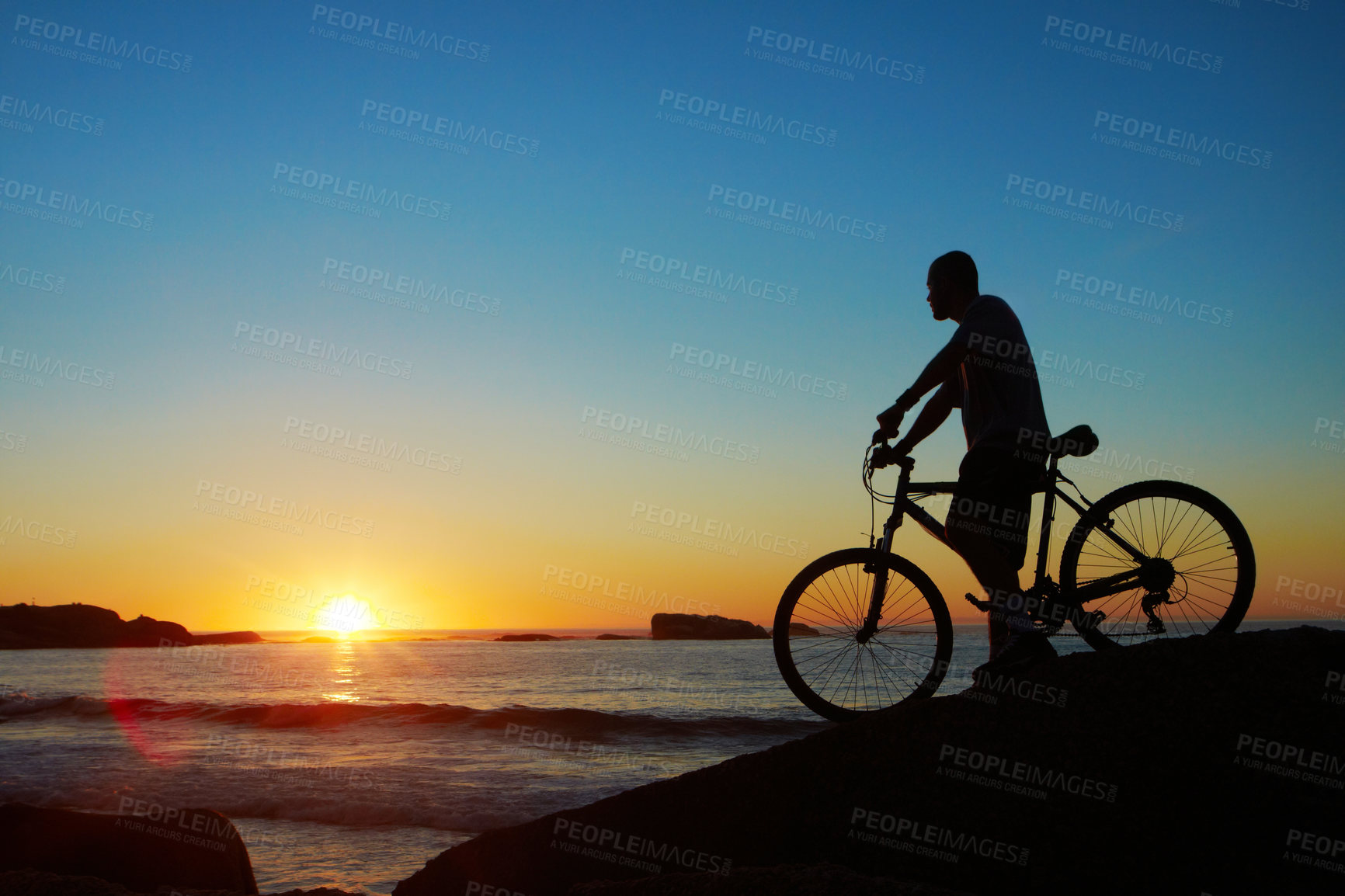 Buy stock photo Man, beach and silhouette with mountain bike, sunset and mockup space by waves for summer cycling adventure. Cyclist, freedom and fitness with bicycle, training or journey by ocean in dusk sunshine