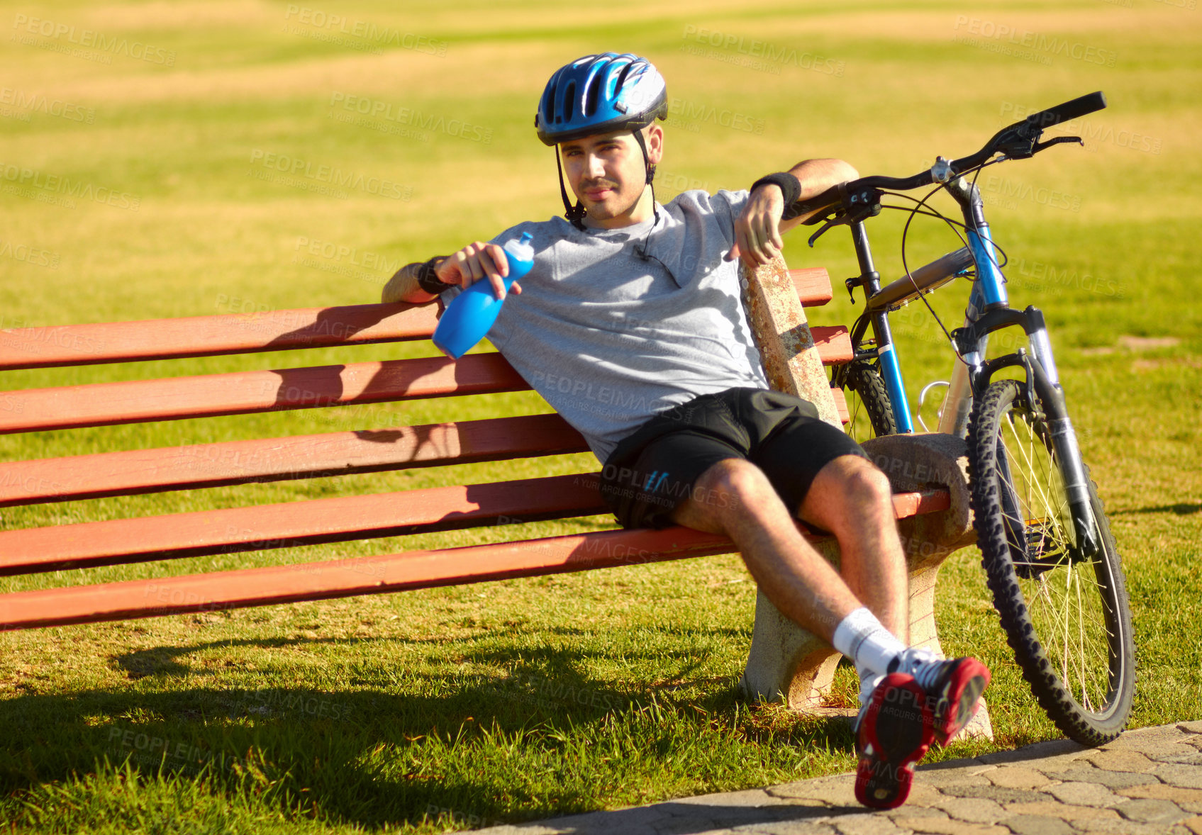 Buy stock photo Cropped shot of a handsome young cyclist outdoors