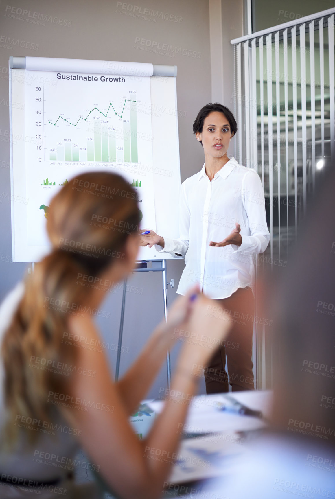 Buy stock photo Business woman, presentation talking and training of a corporate management team with financial chart. Speaking, female worker and collaboration of staff working in a conference room with data 