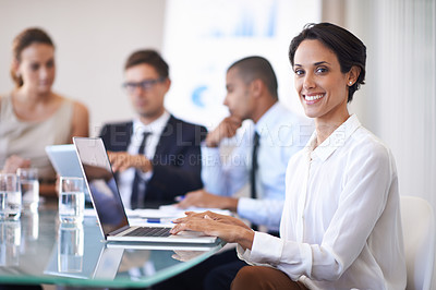Buy stock photo Woman, office and smile in meeting with laptop to brainstorm for contract, paperwork and teamwork or collaboration. Business people, boardroom and table with strategy, feedback and company growth.